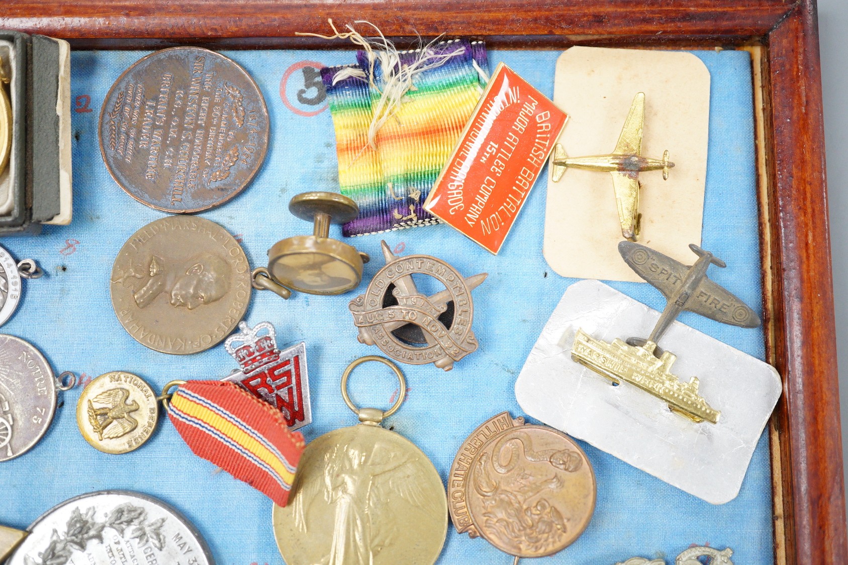 A group of WWI and WW2 and other military medals, badges and ephemera